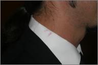 Lipstick on Aneel's collar